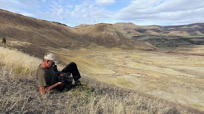 Tim Lewis checks his camera at John Day as he returns from filming in Pilot Rock, Oregon. Photo: Mark Stafford.