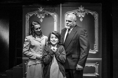 Jenny Parks as Molly, Kenady Conforth as Annie and Tony Joyner as Daddy Warbucks