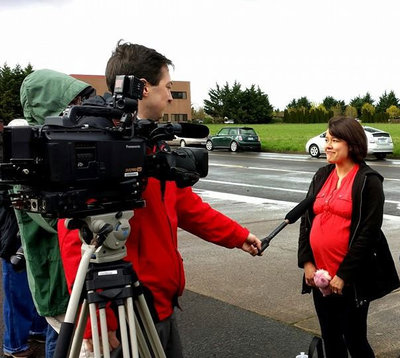 Serena Marksrom talks to reporters in front of the Register-Guard March 27, 2014.