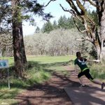 Jessica Boone, a member of the women’s disc golf team heading for a national competition, plays a round at dexter disc golf course
