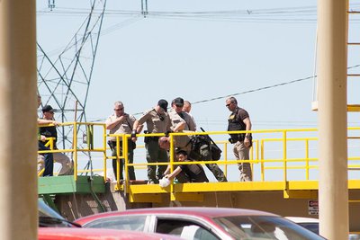 Lane County Sheriff officers cut loose a protester locked down to a truck dump at Seneca’s Biomass Plant
